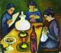 Tres mujeres en la mesa junto a la lámpara August Macke